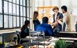 © Ann Rodchua - Selective focus young handsome smart Caucasian Businessman or boss wearing suit, smiling with happiness, confidence, presenting marketing plan or creative idea in meeting room at indoor modern office.