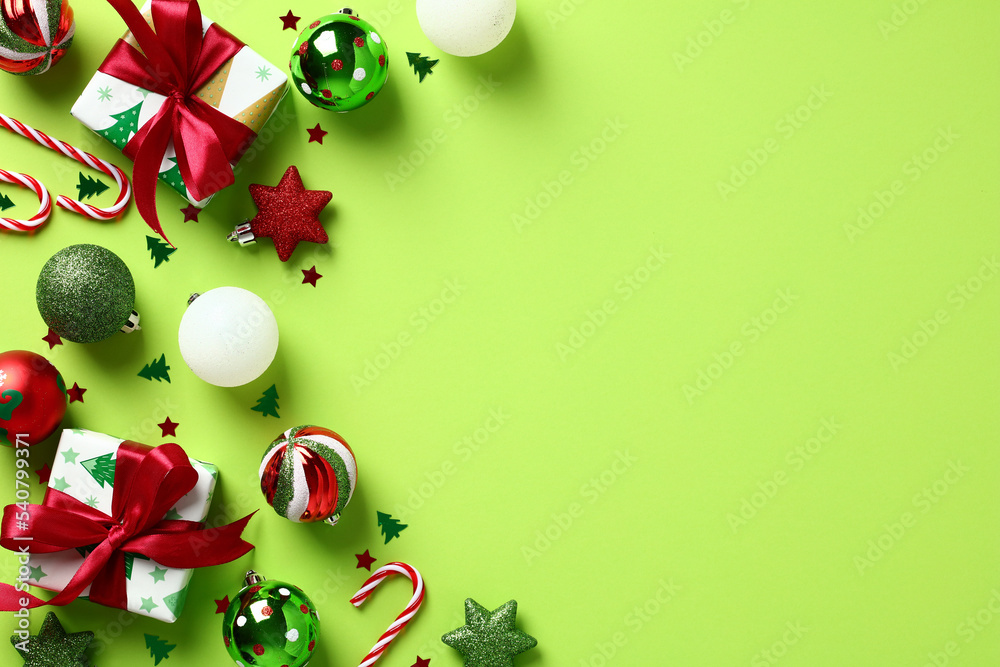 Modern Christmas decorations and gift boxes on pastel green background ...