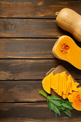 Poster - Fresh butternut squash with thyme and sage on a wooden surface.  Butternut Pumpkin . Healthy food concept.