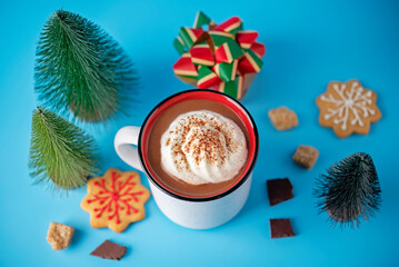 Wall Mural - Winter Christmas holidays background with Cup of cocoa or hot chocolate with whipped cream with cinnamon sprinkles