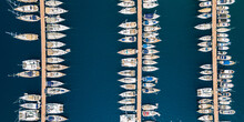 Aerial View Of Different Boats In Marina In Kas,  High Angle View Of  Luxury Yachts Moored On Sea Harbor.  Sailboats Docked In A Row At Port Antalya, Turkey.