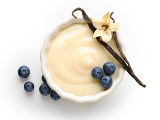 Wall Mural - Ramekin of delicious vanilla pudding with blueberry on white background
