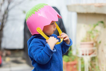 Adorable Baby With An Easter Basket For A Helmet