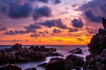 Wall Mural - sunset on the beach, big rocks and sky full of colors, clouds in the sky and waves on the sea, puerto escondido oaxaca 