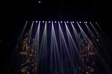Wall Mural - colorful stage spotlights with laser radiation