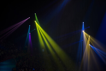 Wall Mural - colorful stage spotlights with laser radiation