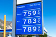 Gas station price sign showing record high gasoline prices for over 7 dollars a gallon of regular gas.