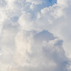 Wall Mural - cloudy sky background. sunlight shining through white clouds.