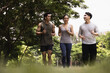 © Panithan - Asian young man and woman jogging together in green park. Concept for healthy lifestyle and oudoor life.