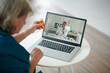 © DragonImages - Elderly Woman Video Calling Doctor
