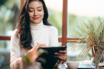 portrait of young business entrepreneur woman lifestyle, professional freelance businesswoman having smile and happy to work using computer laptop on online cyberspace technology, Asian beautiful girl