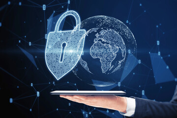Poster - Close up of hand holding smartphone with abstract glowing padlock and globe hologram on blurry blue background. Global web safety and protection concept.