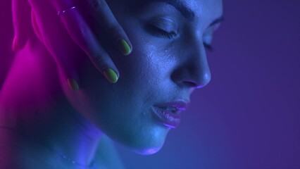 Poster - colorful portrait of beauty model girl. beautiful woman face closeup. uv lights. gorgeous brunette g