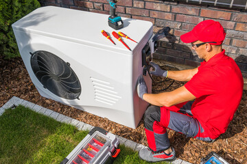 Wall Mural - Technician Repairing Heat Pump Unit