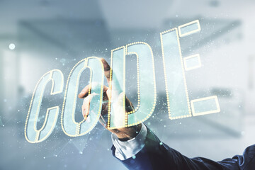 Aufkleber - Man hand presses on Code word hologram on blurred office background, international software development concept. Multiexposure