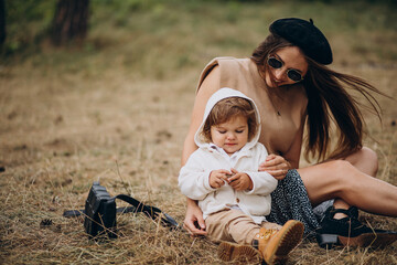 Wall Mural - Fashion mother with son in park