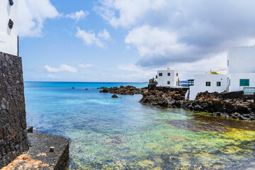 Sticker - Picturesque Punta Mujeres with white architecture and natural pools, Lanzarote, Canary Islands, Spain