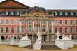 Great close-up view of the famous Electoral Palace with its pink rococo facade at the main entrance of the south wing in Trier, Germany. It now houses various offices of the federal government.