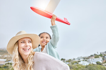 Happy, mother and Girl with airplane toy on travel vacation seaside for fun activity with adoption. Smile, woman and kid on tropical family holiday in costa rica with daughter and mom enjoy playing