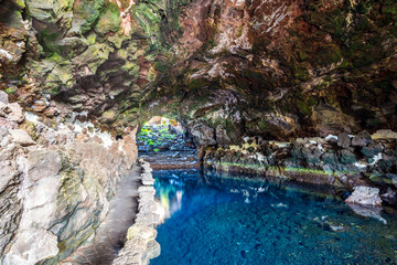 Amazing cave, pool, natural auditorium, salty lake designed by Cesar Manrique in volcanic tunnel called Jameos del Agua in Lanzarote, Spain