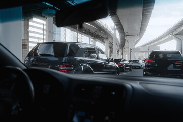 Wall Mural - Car are driving on the road near downtown. Moscow City, business center. View from car inside