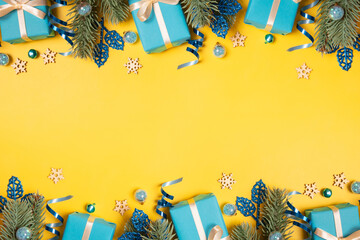 Wall Mural - christmas background with pine tree, gifts and festive decorations top view. christmas flat lay. cop