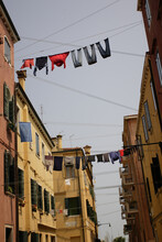 A Narrow Street In Venice, Italy.