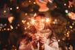© Cavan Images - Teenage girl holding sparklers standing by luminous Christmas tree