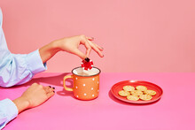 Your Bets. Food Pop Art Photography. Young Girl Tasting Milk With Crackers Isolated Over Pink Background. Concept Of Food, Creativity.