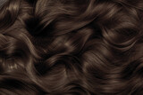 Brown hair close-up as a background. Women's long brown hair. Beautifully styled wavy shiny curls. Hair coloring. Hairdressing procedures, extension.