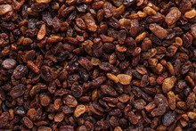 Pile Of Raisins Scattered On Table