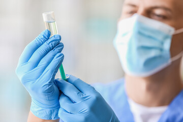 Poster - Male doctor in medical mask with syringe and ampule at hospital, closeup