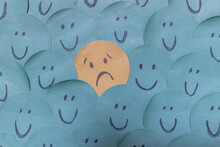 A Sad Face Around Happy Faces - Paper Drawing