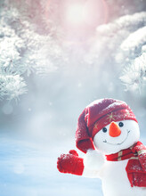 Merry Christmas And Happy New Year Greeting Card .Happy Snowman Standing In Winter Christmas Landscape. Snow Background