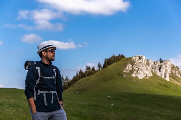 Poster - Cheerful traveler posing in the background of Rarau Mountains, Romania