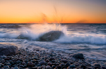 Wall Mural - sea storm with splash from waves on rocky shore