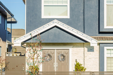 Wall Mural - The top of the house or apartment building with nice window.