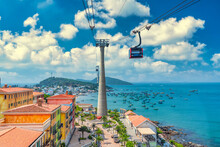 The Longest Cable Car Ride In The World, Phu Quoc Island In South Vietnam. Below Is Traditional Fishermen Boats Lined In The Harbor Of An Thoi Town In The Popular Hon Thom Island. Travel Concept.