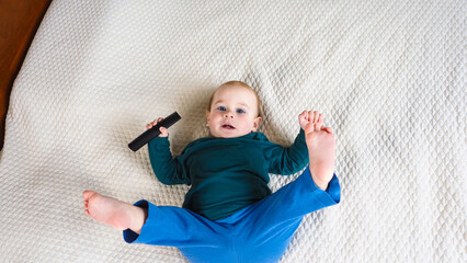 Wall Mural - Portrait baby boy laying on the bed