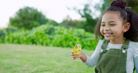 Wall Mural - Happy girl kid blowing soap bubbles in park, garden and nature for playful fun, joy and childhood development, growth and sunshine relax. Laughing child, bubble wand and outdoor toy games in Brazil