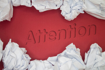 Poster - Attention text with Torn, Crumpled White Paper on colored background.
