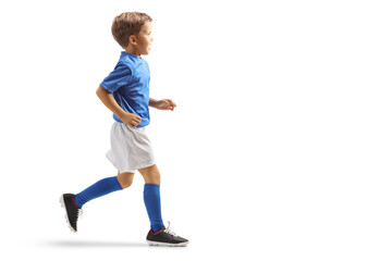 Canvas Print - Profile shot of a boy wearing a sports jersey and running