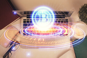 Poster - Blockchain theme hologram drawings over computer on the desktop background. Top view. Double exposure.