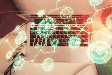 Poster - Social network hologram drawings over computer on the desktop background. Top view. Double exposure.