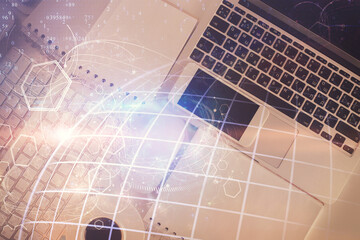 Poster - Double exposure of map hologram drawing over study table background with computer. Concept of international network. Top view.