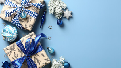 festive christmas banner template with gift boxes, fir branches, silver and blue decorations on past