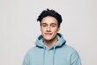 © Tatiana - horizontal portrait of a pleasantly smiling young man in a light hoodie looking into the camera