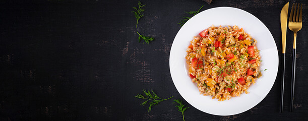 Wall Mural - Tomato rice with vegetables and chicken. Healthy food. Healthy lifestyle. Top view, banner