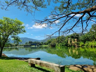 The beautiful natural scenery of lakes, trees, mountains, clouds and sky is a summer travel in Asia. with a landscape and a peaceful and shady environment