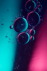 Wall Mural - air bubbles in water in colorful light